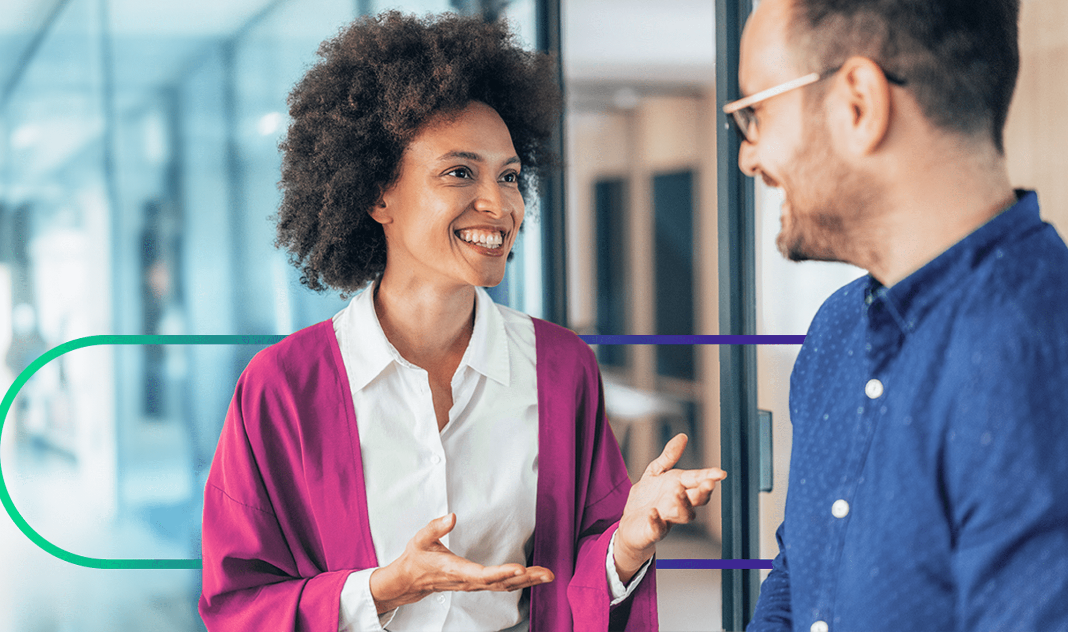 Two colleagues talking in an office setting.
