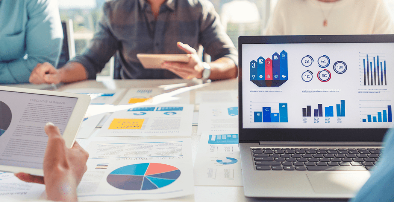 Office meeting presenting data in graphs